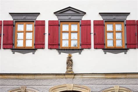 Framework Historical Building Facade With Red Window Shutters Stock