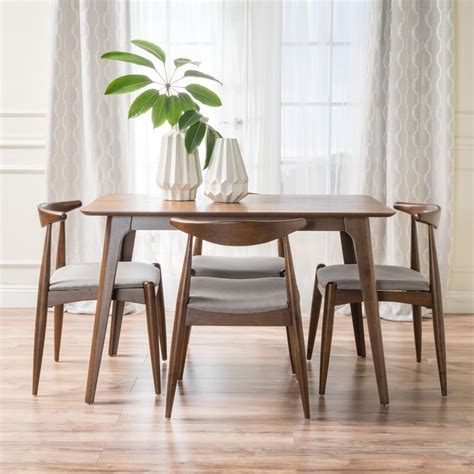 Their molded plywood, then molded fiberglas discoveries led to an extensive collection of low cost, mass produced midcentury modern dining room chairs, office chairs and lounge chairs. Millie 5 Piece Mid Century Dining Set & Reviews | AllModern