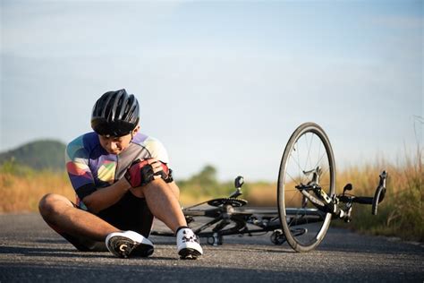 premium photo bike injuries man cyclist fell off road bike while cycling