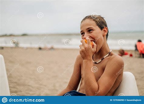 Wet Babe Biting Apricot On The Beach And Smiling Stock Photo Image Of Horizon Beach