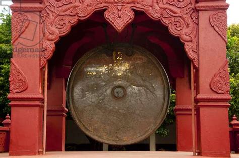 Thailand One Of The Worlds Largest Gong Hangs In The Grounds Of Wat