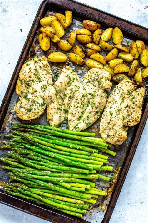 Full of fresh spring veggies, this cozy recipe can help make the slow transition from winter to spring a bit more bearable. Sheet Pan Chicken and Asparagus - The Girl on Bloor