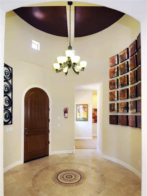 Rectangular rectangular or console tables when covered with a table cloth are tailored and more formal than a round table. Decorating Ideas For A Round Foyer | Foyer decorating ...
