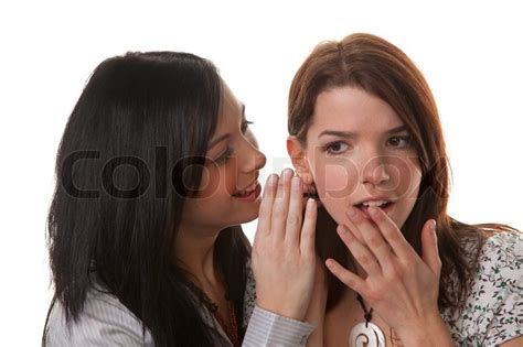 Two Young Girls Whisper The Latest News Stock Image Colourbox