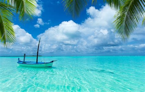 Premium Photo Boat On Tropical Beach On Sunny Day