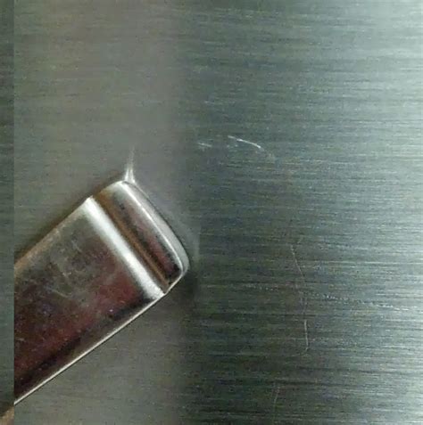 Could you scratch black steel and what does it look like after it has been scratched? Fix Lovely: How to repair shallow scratches in brushed stainless steel