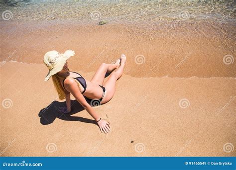 Woman Lying On The Sand The Ocean Coast Summer Vocation Stock Image