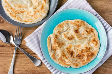 While you're there, you should also try their signature side dishes—fried you best believe it's that good as there are long queues every morning; Roti Canai | Asian Inspirations