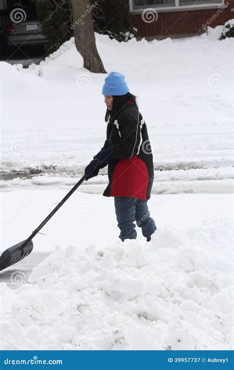 Lady Shoveling Snow From Driveway Stock Image Image Of White Shovel