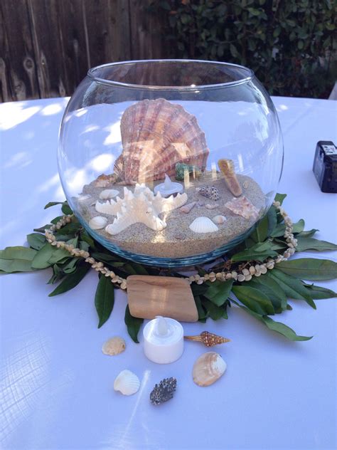 When most people think of beach themed wedding centerpieces, they envision sand, seashells, and starfish. Beach wedding, Hawaiian theme centerpieces, seashells ...