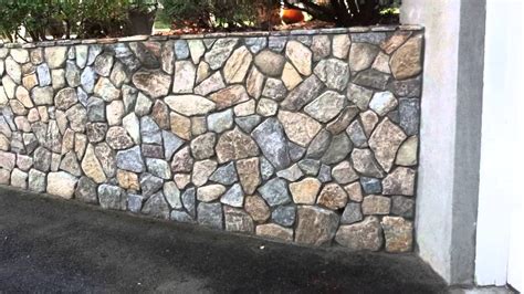 Stone Veneer Over Poured Concrete Wall Youtube