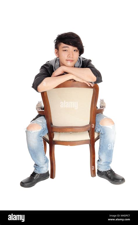 Asian Man Sitting Backwards On Chair Stock Photo Alamy