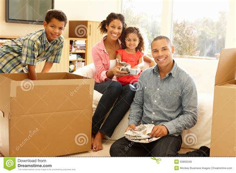 Mixed Race Family in New Home Stock Photo - Image of mixed, estate