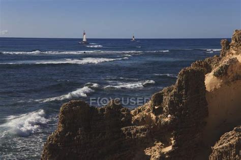 Sailboats Cruise Along Coastal Formations — Water Ocean Stock Photo