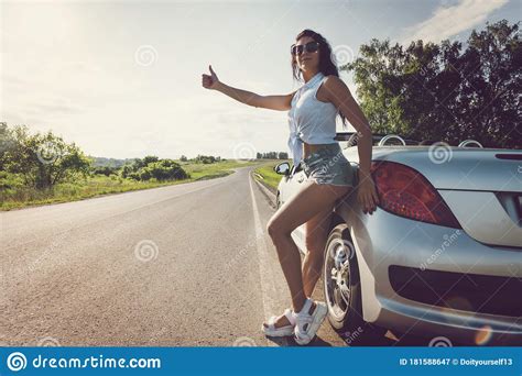Beautiful Woman Hitchhiking By A Broken Car Beautiful Young Girl In