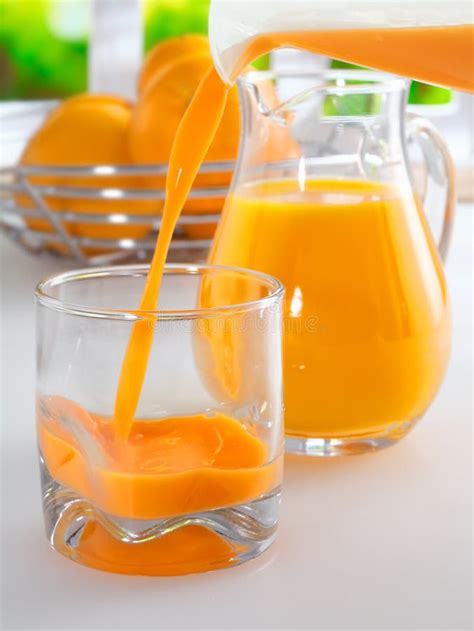 Pouring A Glass Of Fresh Orang Juice Stock Photo Image Of Orange