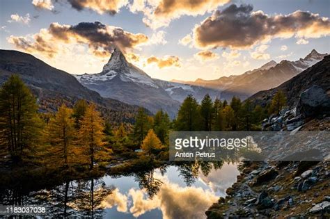 Matterhorn Peak With Golden Larch Reflected In Grindjisee Lake In