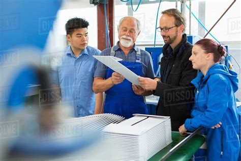 Factory Workers With Supervisor Stock Photo Dissolve