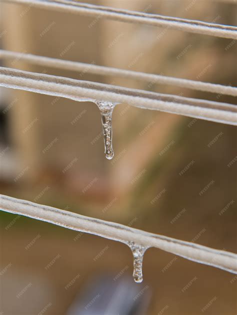 premium photo ice covered clothesline with icicles