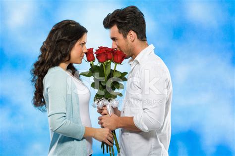 Couple Holding Roses Together Stock Photo Royalty Free Freeimages