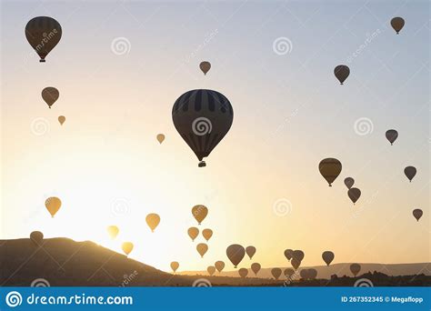 Sunset Sky And Many Hot Air Balloons Over Hills Stock Image Image Of