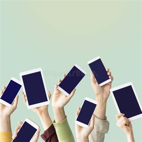 Hands Raised Holding Mobile Devices Stock Image Image Of Online