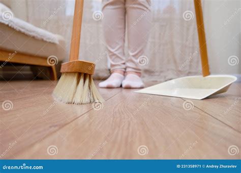 Woman Sweeping Floor With Broom And Dustpan While Cleaning Home Living