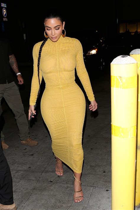 kim kardashian â€“ sexy curves in tight yellow dress at carousel restaurant in glendale 1
