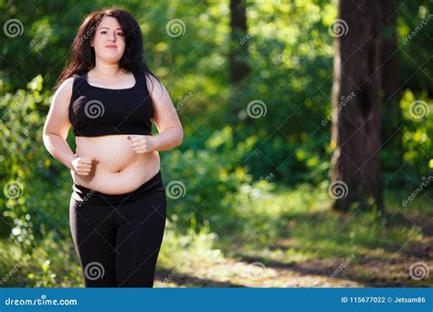 Young Overweight Woman Jogging In The Park Stock Photo Image Of