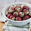 A bowl of simple boiled red potatoes -- dressed up by a peeled center ...