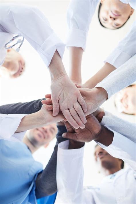 Team Of Medical Professionals Huddling Stock Photo Image Of Males