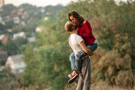 Young Man Lifted Up Girl And They Kiss On Walk In Forest Stock Image Image Of Lift Caucasian