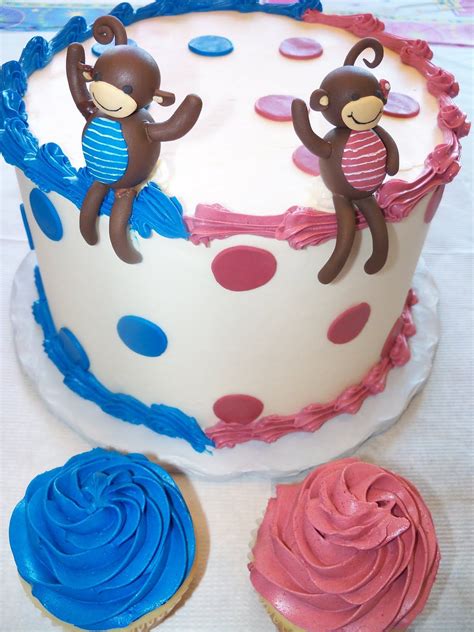 There Is A Decorated Cake With Two Monkeys On It