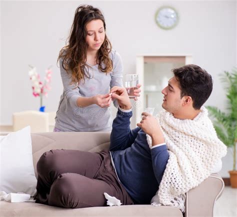Wife Caring For Sick Husband At Home Stock Photo Image Of Lying