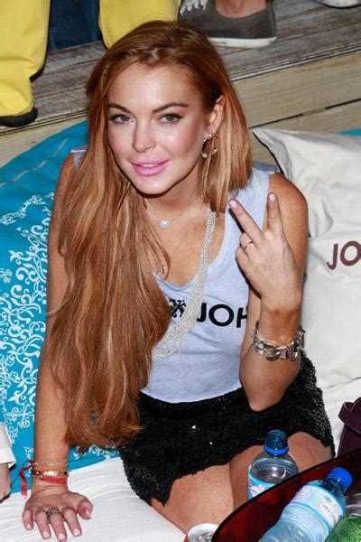 Lindsay Lohan Has A Wardrobe Malfunction And Continues Partying In Brazil