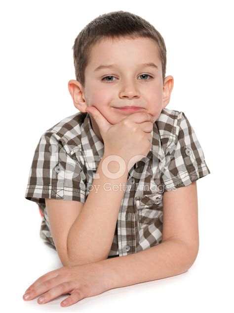 Cute Pensive Boy Is Lying On The White Stock Photo Royalty Free
