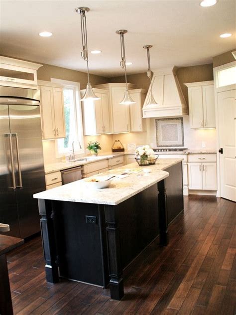 They are fine grained in appearance and have a dark color with swirls of color and intricate grain patterns that you won't find in lesser woods. Dark Wood Floors with cream cabinets and dark island ...