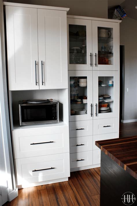 In 2015, ikea discontinued their line of kitchen cabinets called akurum and replaced them with sektion kitchen cabinets. white-IKEA-microwave-cabinet-7879 | HappiHomemade with Sammi Ricke