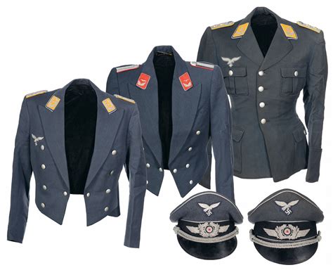 Three Luftwaffe Dress Jackets And Two Peaked Caps