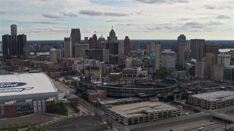 5 7k stock footage aerial video flying by comerica park with view of skyline reveal ford field