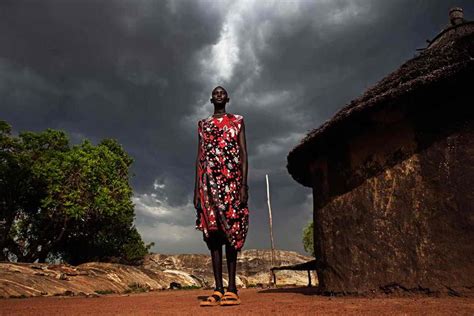 Scenes From Sudan ~ Dinka Woman Stands Outside Her Home As A Storm Gathers Tall African Tribe