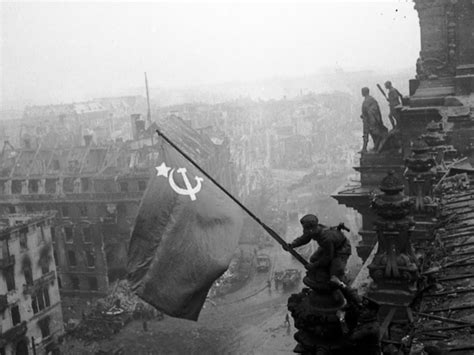 Raising A Soviet Flag Over The Reichstag During The Battle Of Berlin On