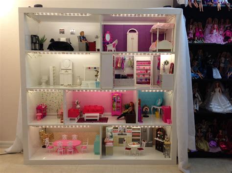 barbie house from expedit shelves now with lighting also we put on a permanent wood backing