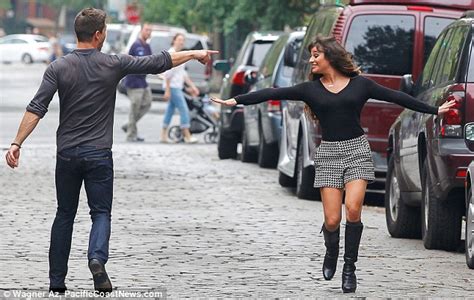 clad in sexy knee high boots lea michele throws out some moves in manhattan for the new