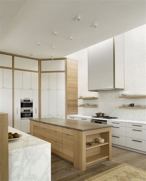 Embrace the oak and create some contrast in your space by painting the surrounding walls a different, but complementary, shade. Modern oak kitchen designs - trendy wood finish in the kitchen