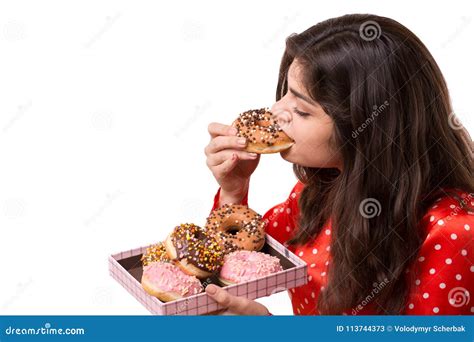 An Isolated Shot Of A Beautiful Caucasian Woman Eating Donut Stock Image Image Of Business