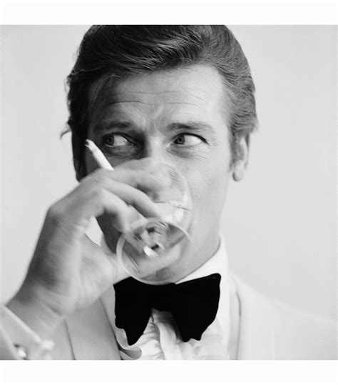 Roger Moore Well Known For His Roles As James Bond And The Saint Downs A Martini Photo