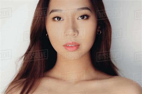 Portrait Of Naked Babe Chinese Woman Looking At Camera Over White Background Stock Photo