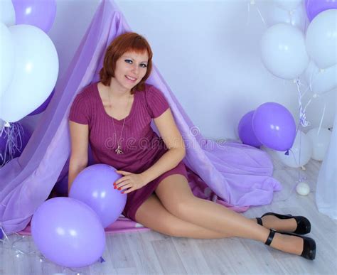 Beautiful Long Legged Redhead Girl In Violet Dress And Shiny Stockings