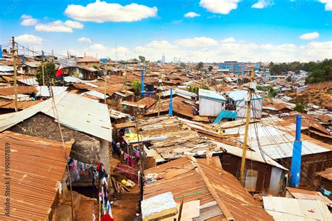 Kibera Slum In Nairobi During Sunny Day With Blue Sky And Clouds